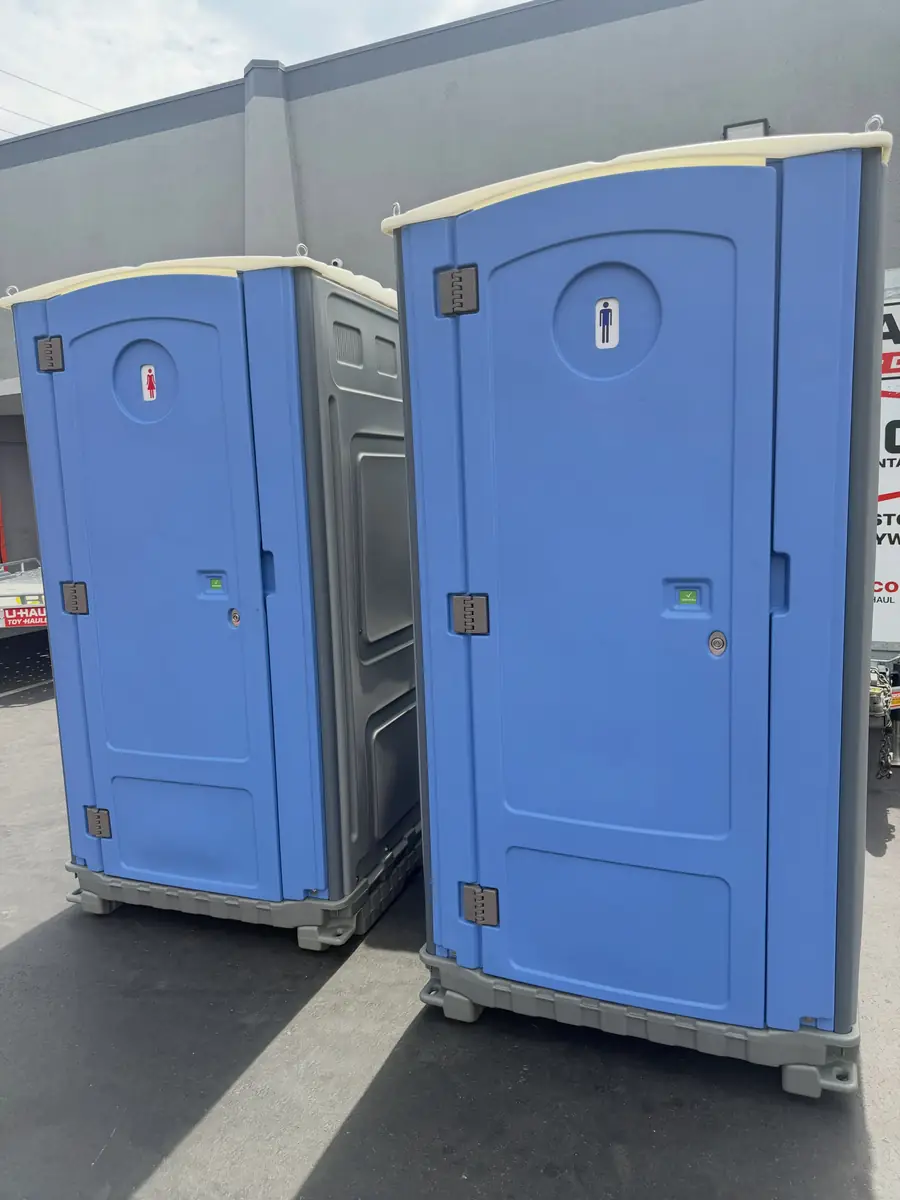 Two standard portable toilets side by side
