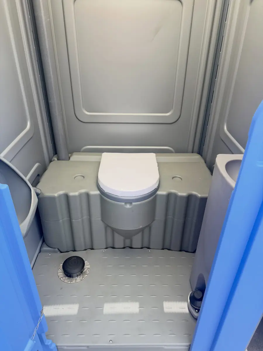 Wide open floor inside a large portable restroom